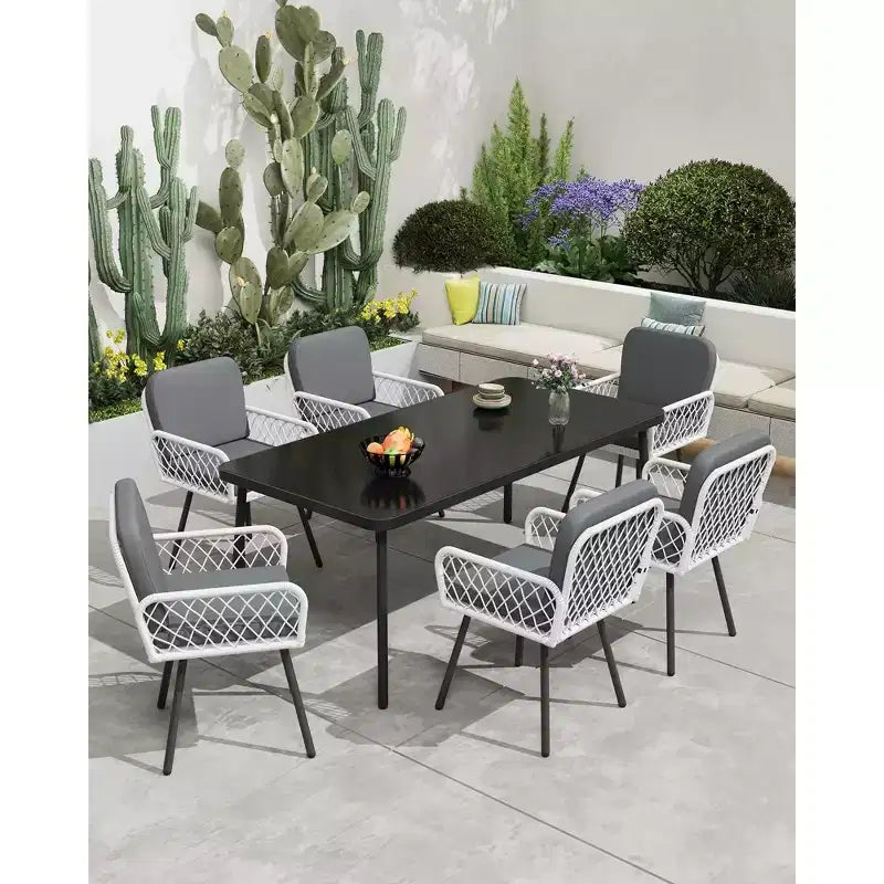 Ensemble de salle à manger d'extérieur TROPOW, table en métal noir 150x90cm avec plateau en verre trempé et 6 chaises en osier, ensemble table et chaises de patio avec coussins gris