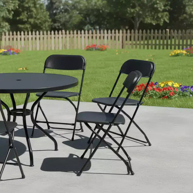 HomeRoots - Lot de quatre chaises de salle à manger pliantes empilables en métal noir pour l'extérieur