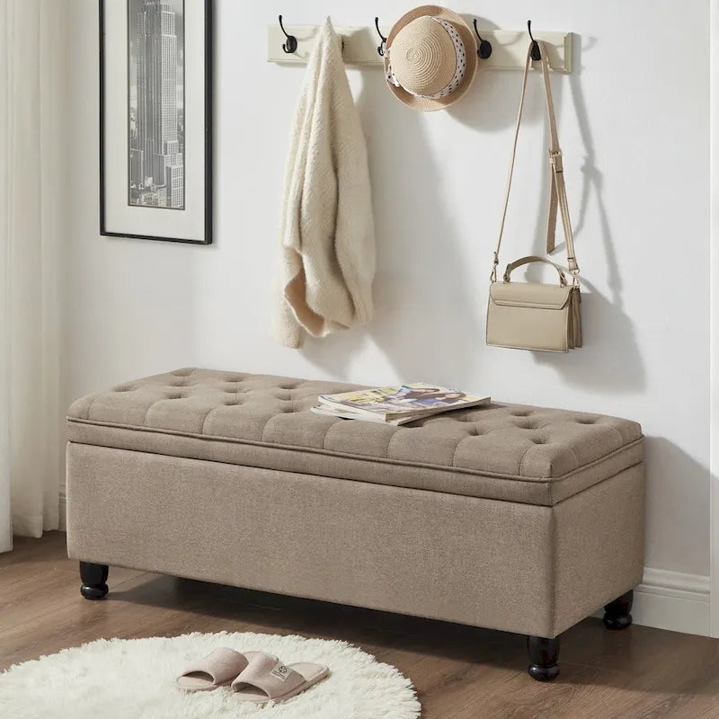 Banc de rangement capitonné en tissu de lin avec pieds fuselés en bois