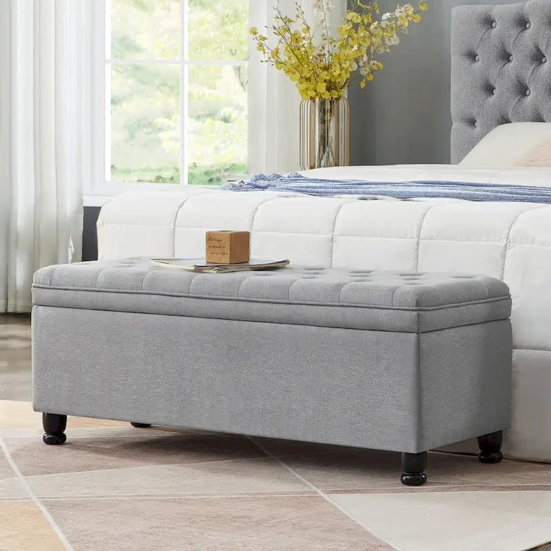 Banc de rangement capitonné en tissu de lin avec pieds fuselés en bois