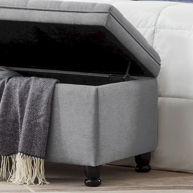 Banc de rangement capitonné en tissu de lin avec pieds fuselés en bois
