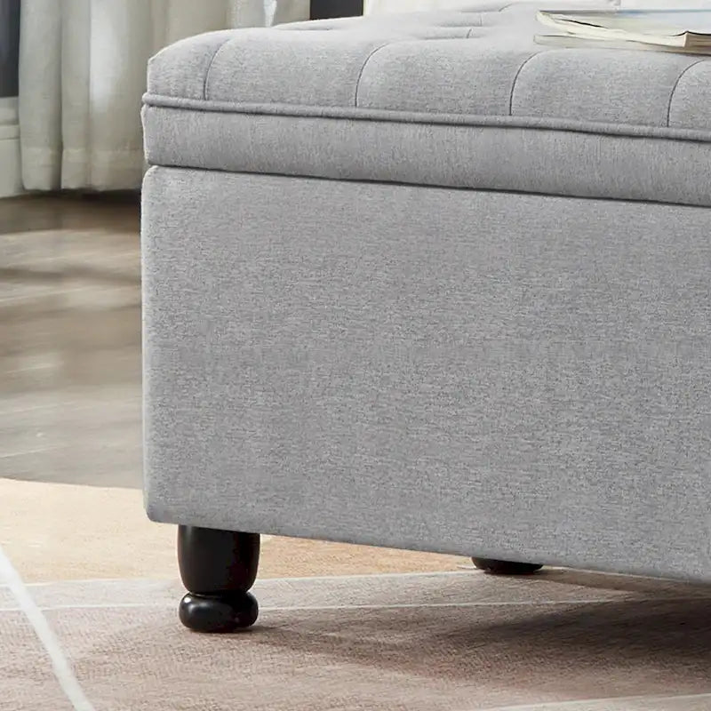 Banc de rangement capitonné en tissu de lin avec pieds fuselés en bois