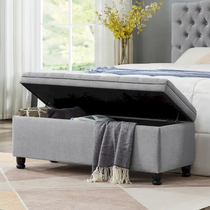 Banc de rangement capitonné en tissu de lin avec pieds fuselés en bois