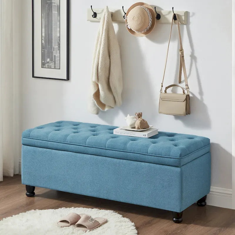Banc de rangement capitonné en tissu de lin avec pieds fuselés en bois