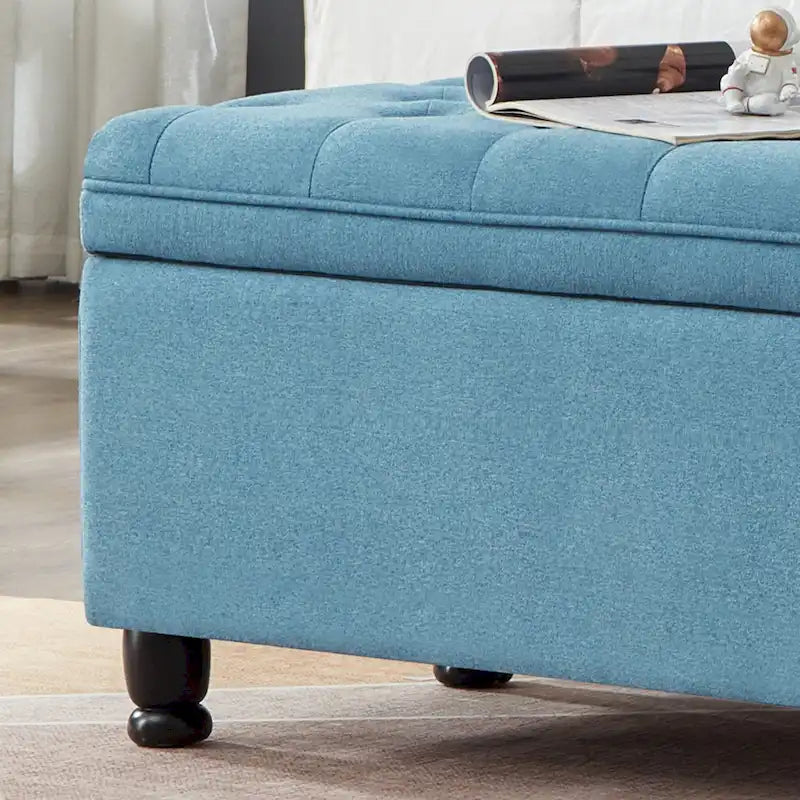 Banc de rangement capitonné en tissu de lin avec pieds fuselés en bois