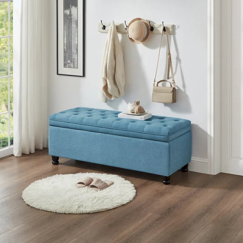Banc de rangement capitonné en tissu de lin avec pieds fuselés en bois