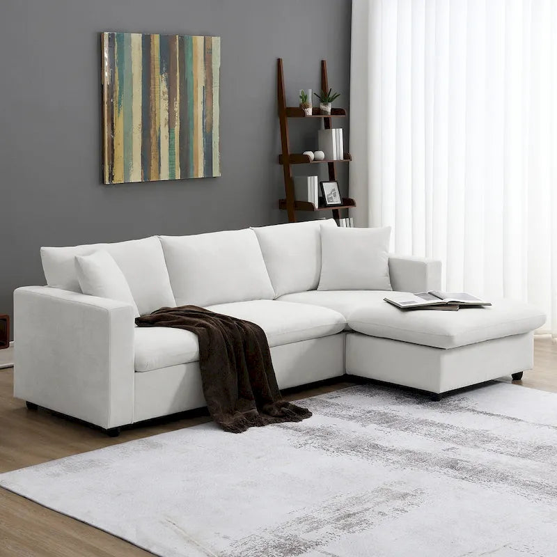 Canapé en tissu polyester en forme de L avec 2 coussins offerts et pouf convertible