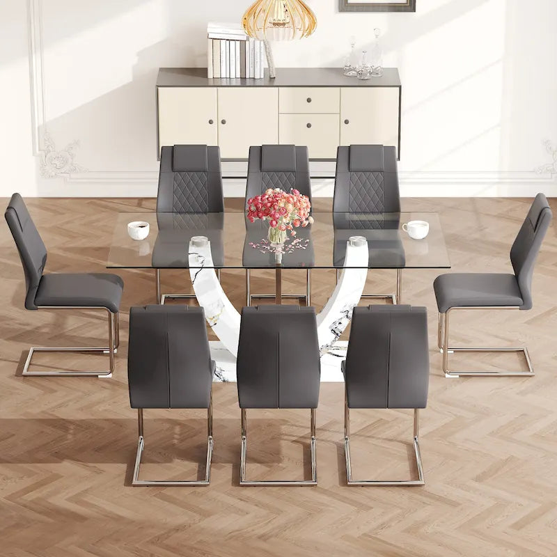Ensemble de salle à manger moderne avec table en verre trempé, piètement en U à motif marbre et chaises rembourrées en similicuir.