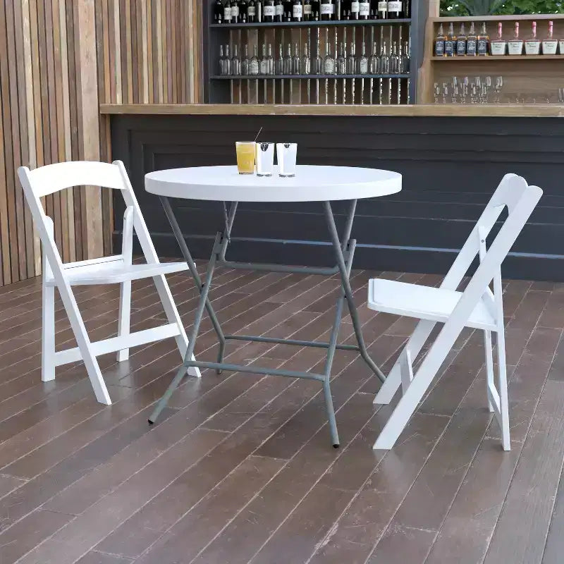 Table pliante ronde Emma et Oliver de 0,80 m en plastique blanc aspect granit - Table événementielle