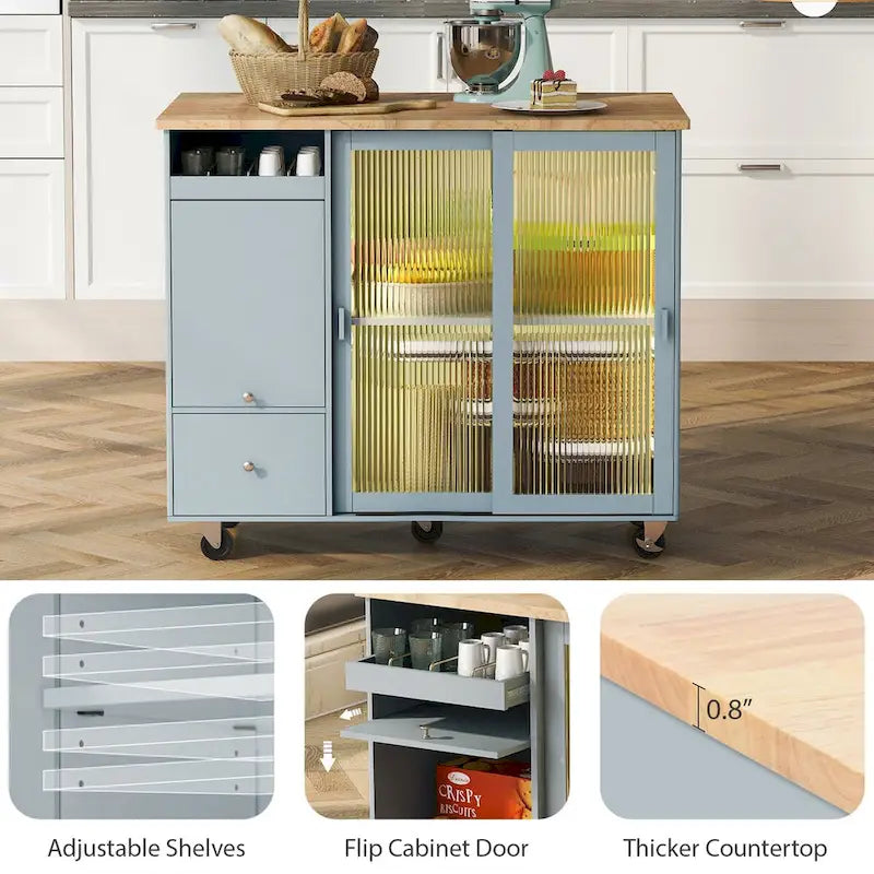 Îlot de cuisine avec surface à rabat, éclairage LED, portes en verre cannelé, étagère réglable, deux tiroirs et roulettes.