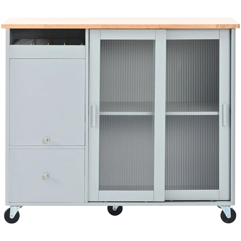 Îlot de cuisine avec surface à rabat, éclairage LED, portes en verre cannelé, étagère réglable, deux tiroirs et roulettes.