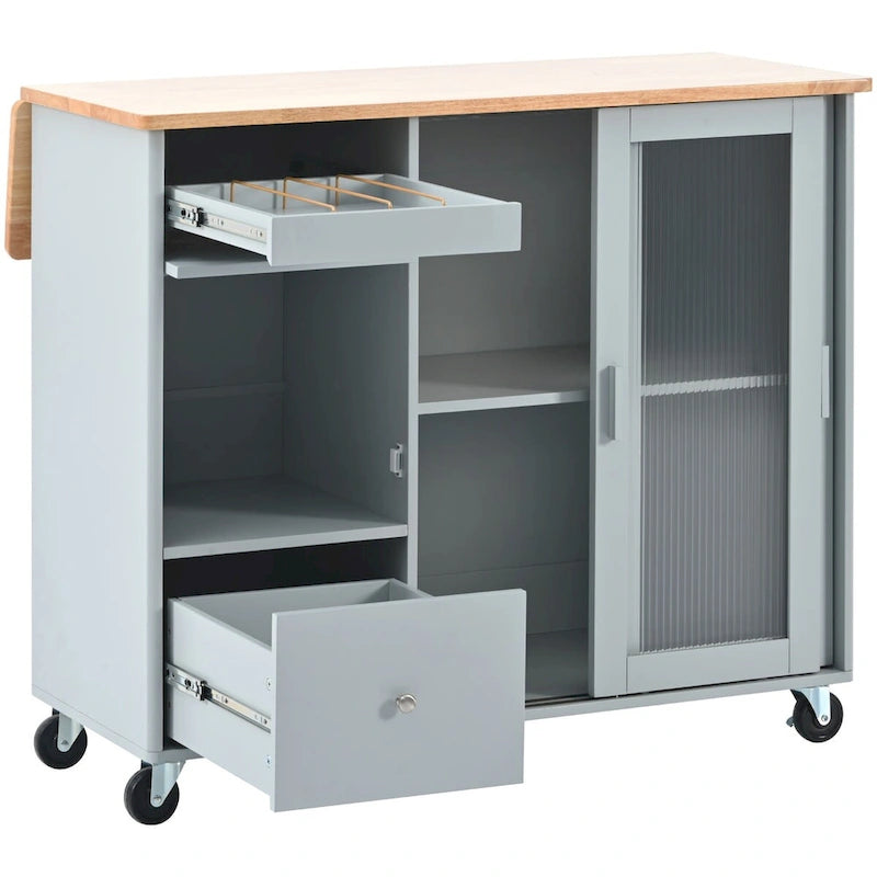 Îlot de cuisine avec surface à rabat, éclairage LED, portes en verre cannelé, étagère réglable, deux tiroirs et roulettes.