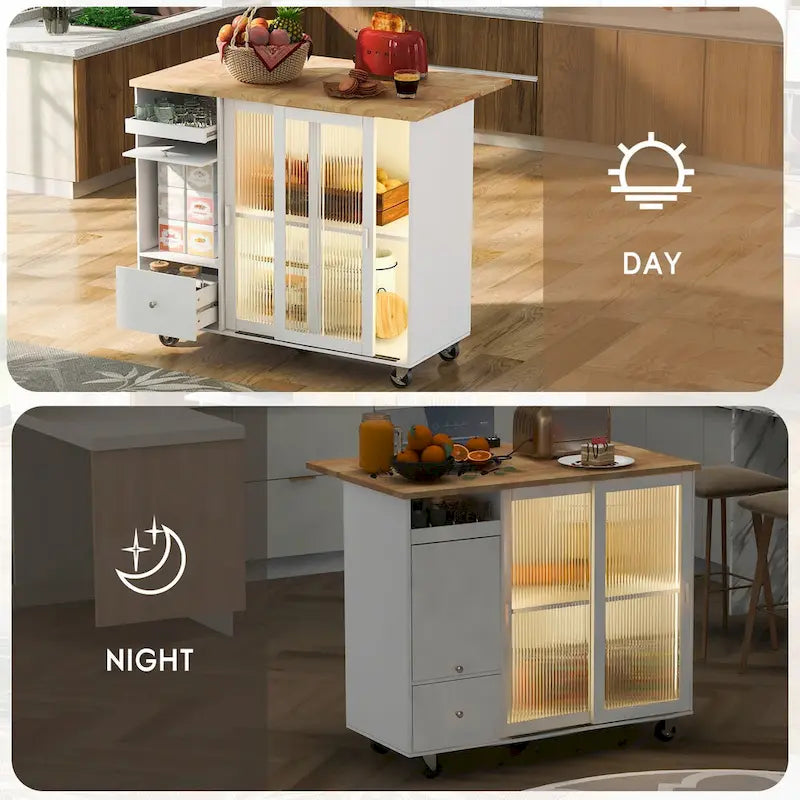 Îlot de cuisine avec surface à rabat, éclairage LED, portes en verre cannelé, étagère réglable, deux tiroirs et roulettes.