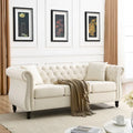 Canapé Chesterfield 3 places en velours beige, accoudoirs roulés, garniture cloutée