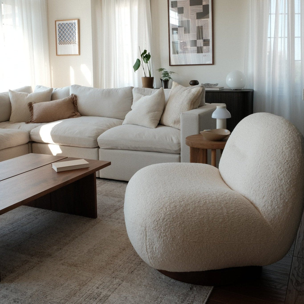 Fauteuil lounge minimaliste avec piètement pivotant et rond