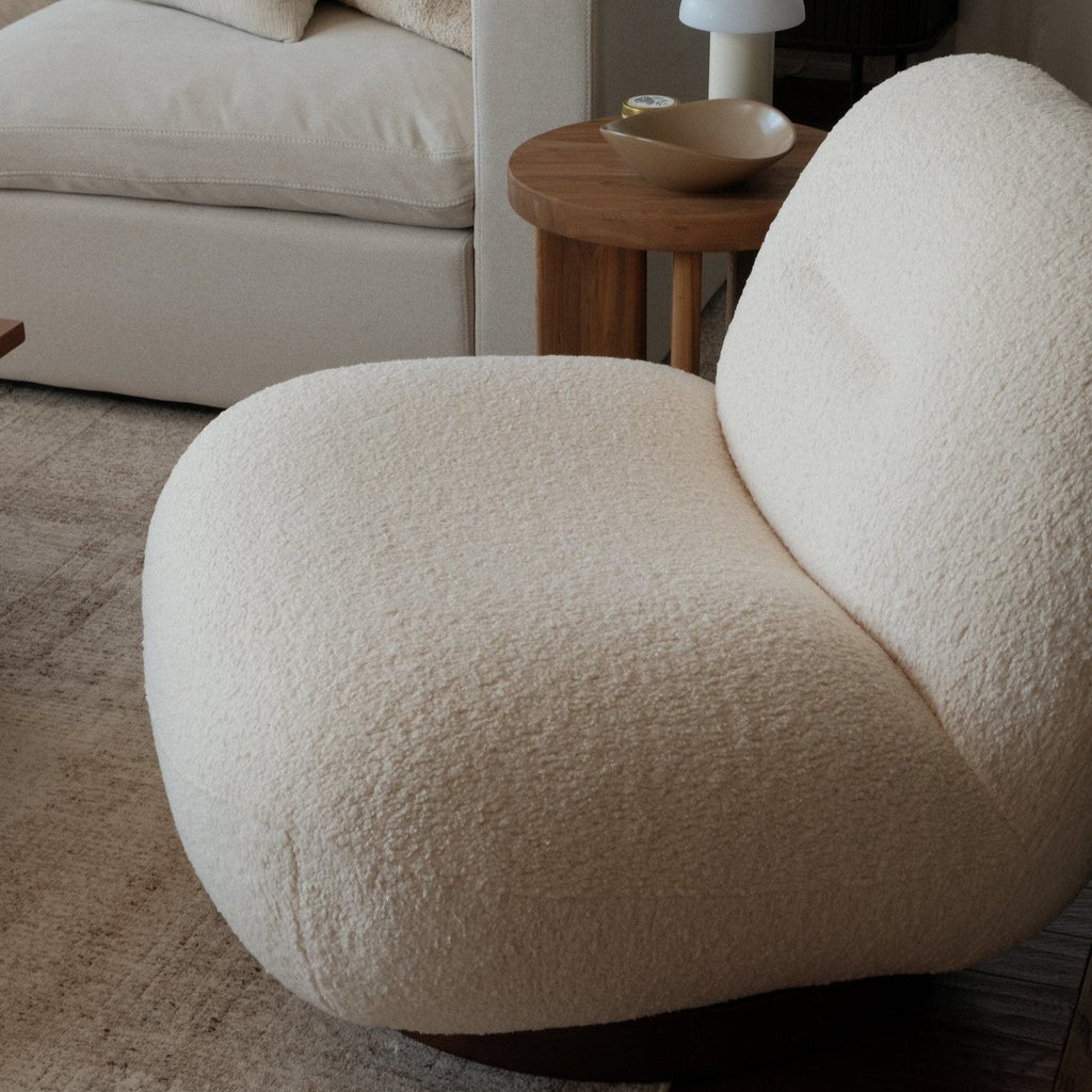 Fauteuil lounge minimaliste avec piètement pivotant et rond